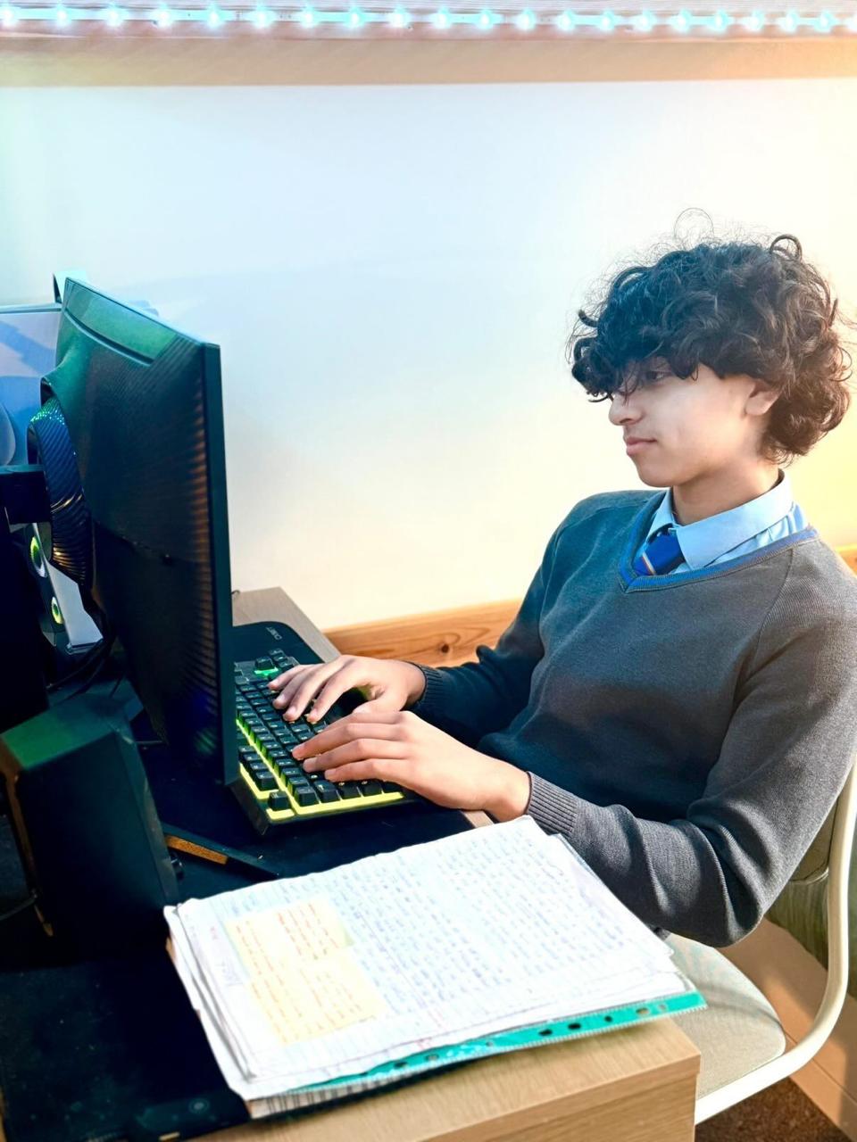 Student attending a live online lesson at Iman British Online School